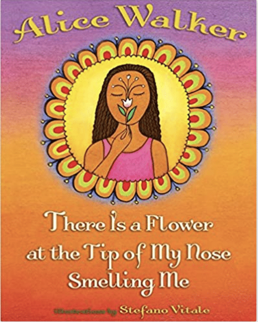 There is a flower at the tip of my nose smelling me